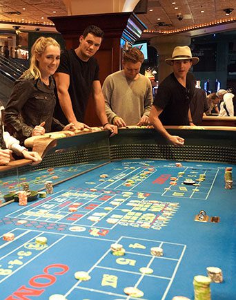 gamblers at a casino table shows Reno nightlife