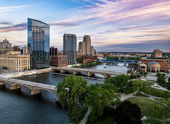 building dot the skyline of Grand Rapids as the river flows past