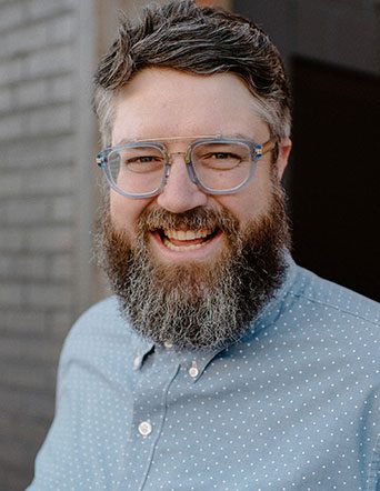 man with beard and glasses