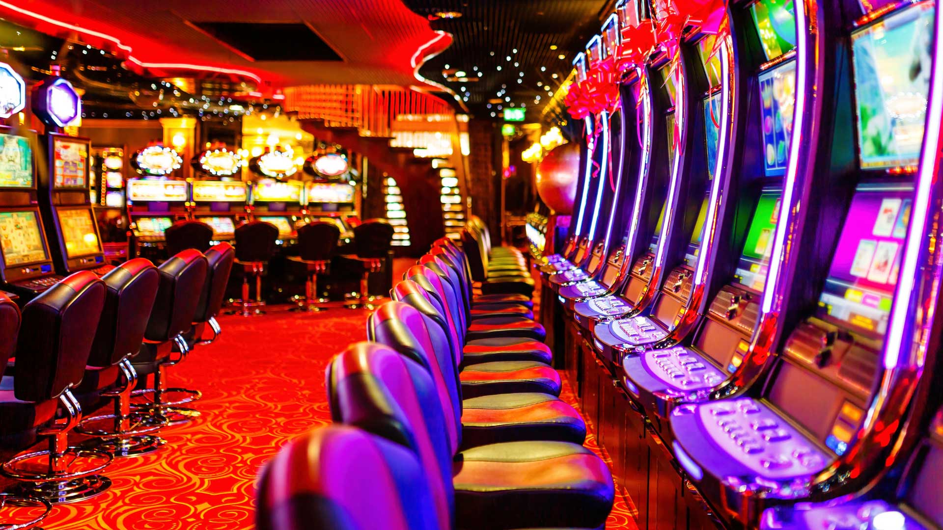 chairs and slot machines line the casino floor