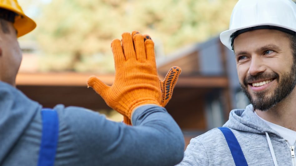 Construction workers high-fiving