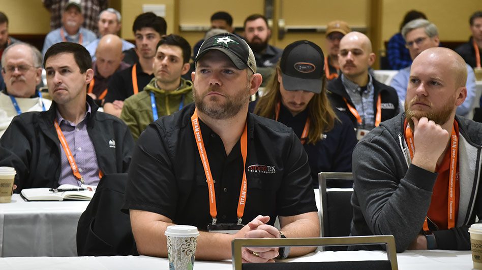 The Precast Show attendees listen to a speaker during an education session