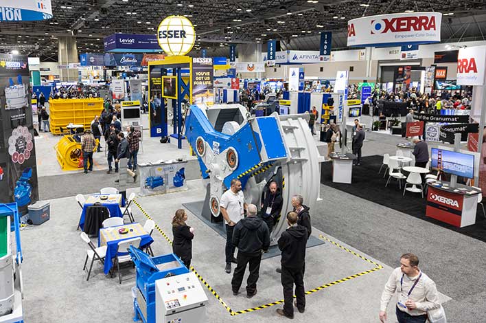 people visit booths at The Precast Show trade floor