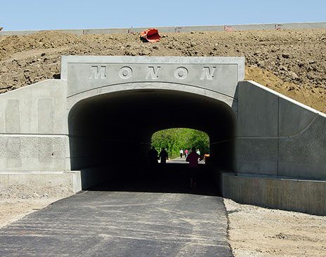 Precast concrete pieces form a pass-through along the Monon Trail.