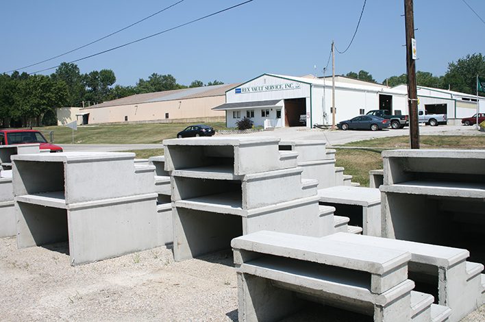 Sets of precast concrete steps are stacked in a manufacturer's precast yard.