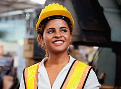 Woman in a hard hat smiling