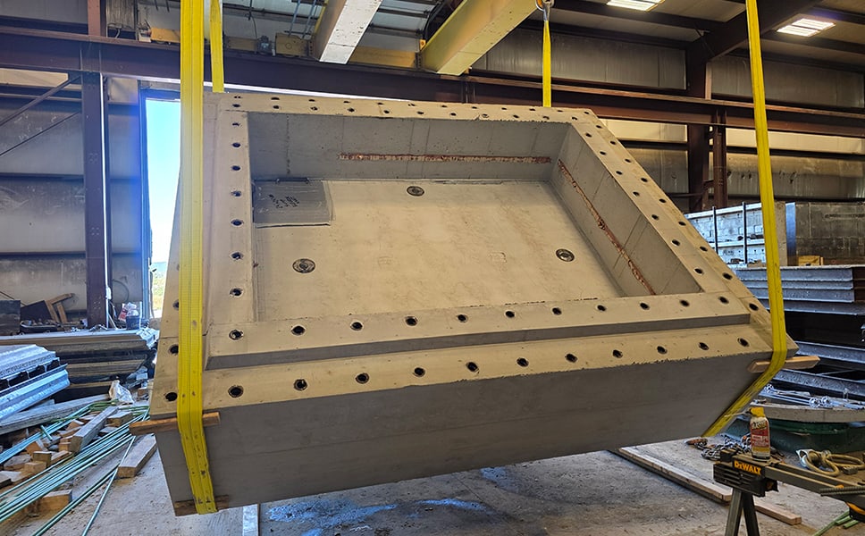 Concrete elevator shaft piece hanging in a warehouse