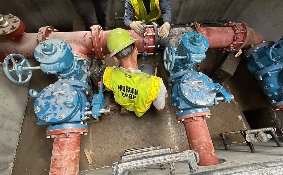 Workers working on a Lake Lure sewer pump station